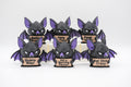 Group of bat figures holding six humorous signs