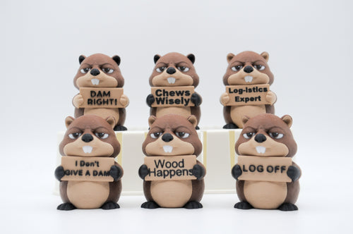 Group of beaver figures holding six humorous signs