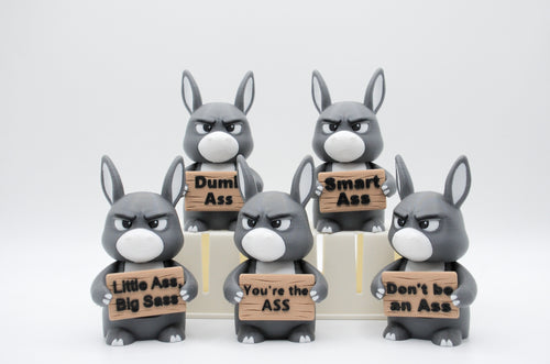Group of donkey figures holding five humorous signs