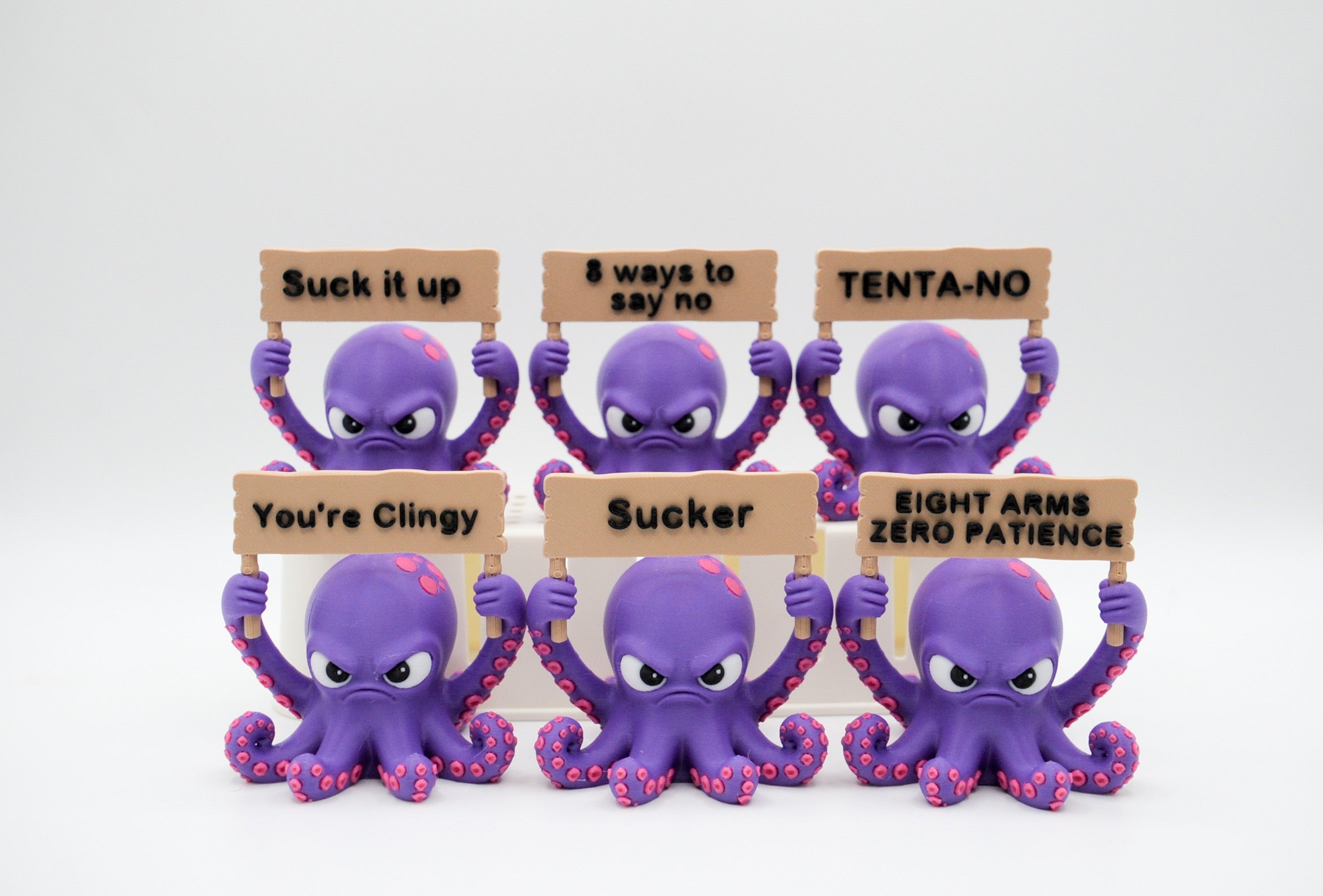 Group of purple octopus figures holding six humorous signs