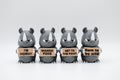 Group of rhinoceros figures holding four humorous signs