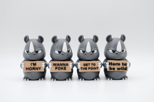 Group of rhinoceros figures holding four humorous signs