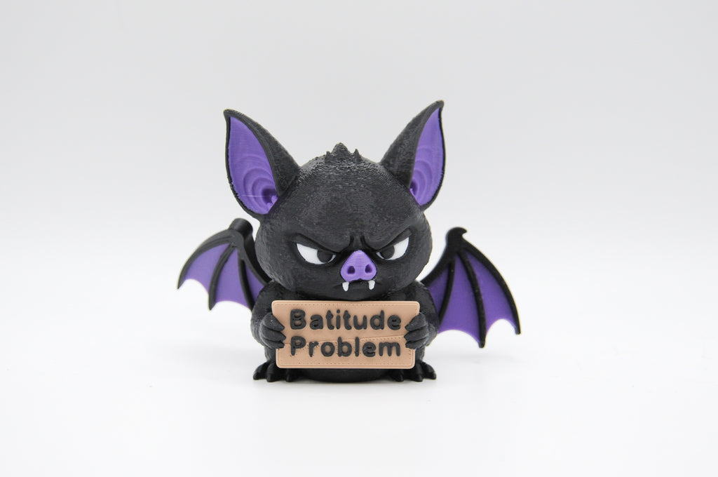 Bat holding a Batitude Problem sign