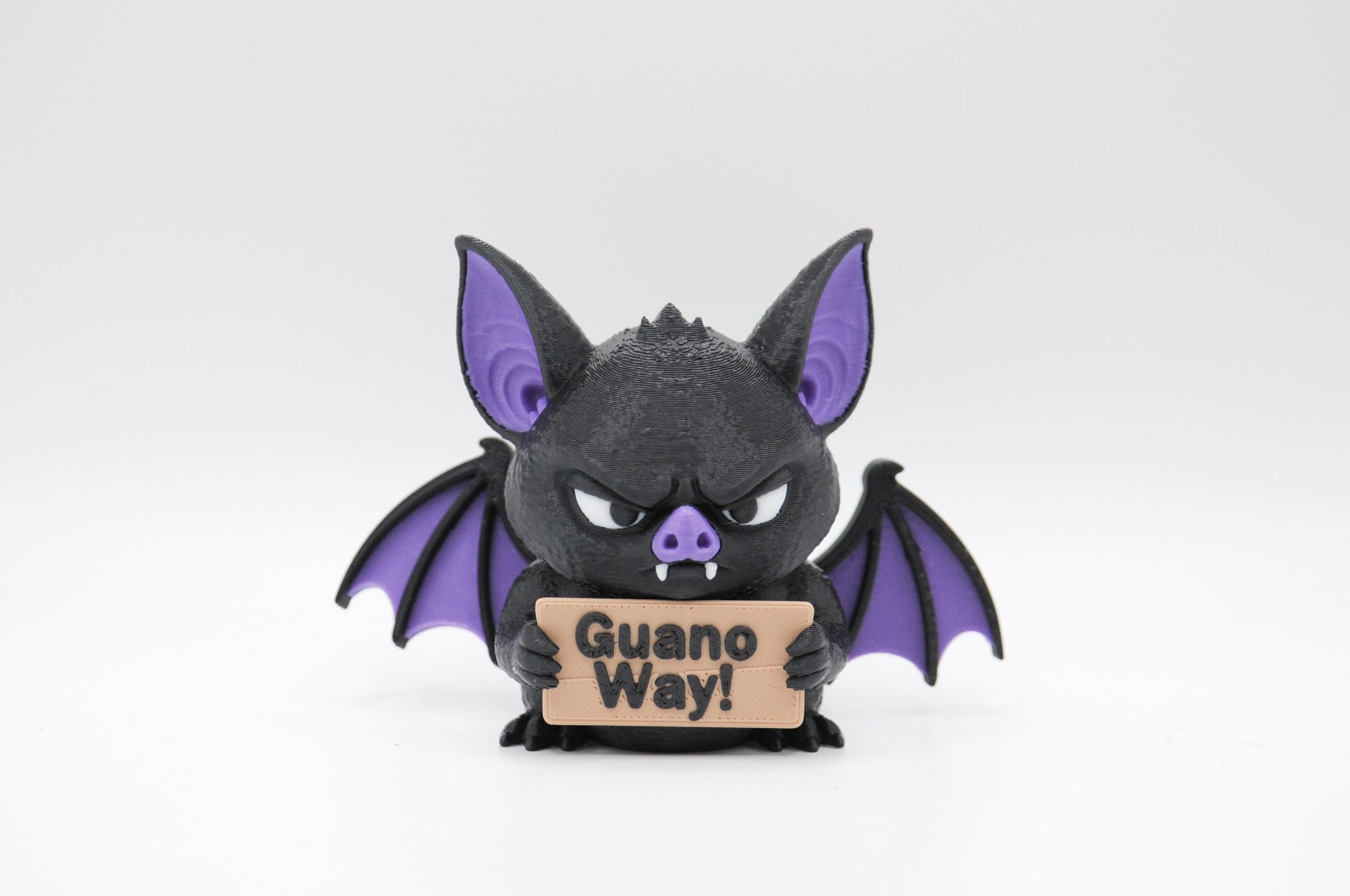 Bat holding a Guano Way sign