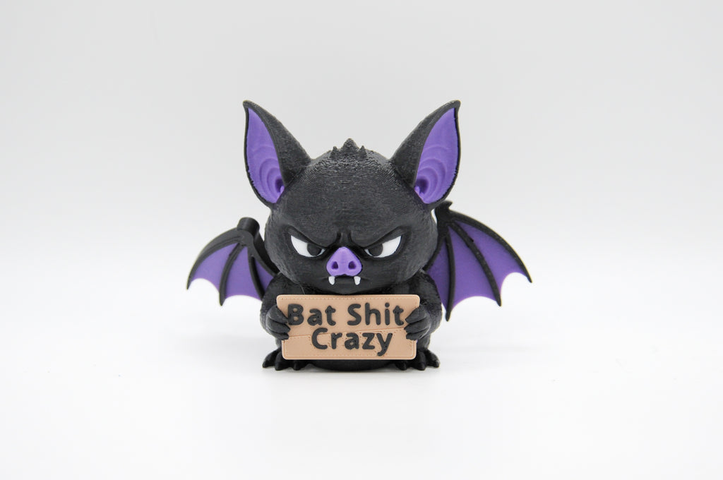 Bat holding a Bat Shit Crazy sign