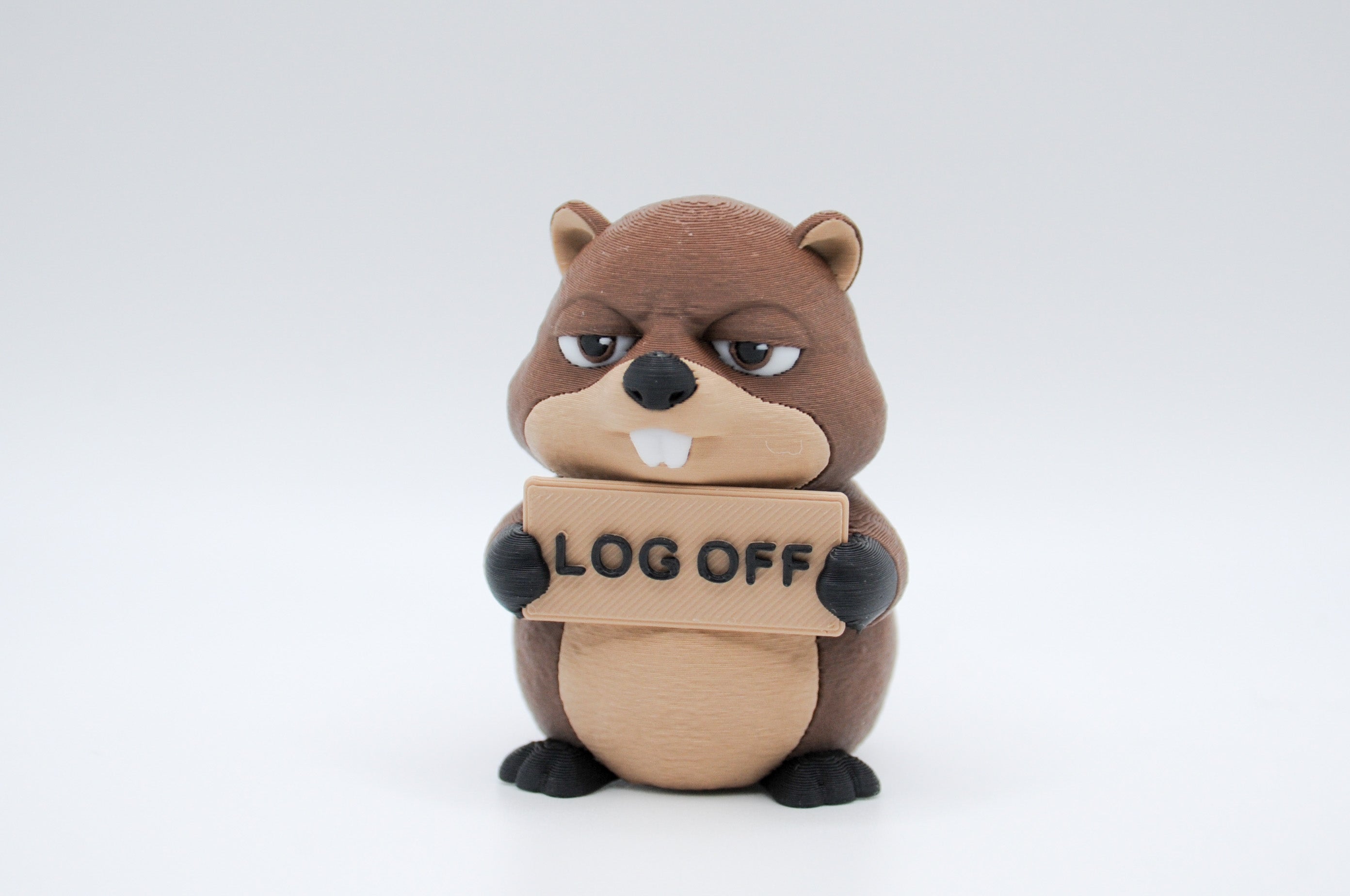 Beaver holding a Log Off sign