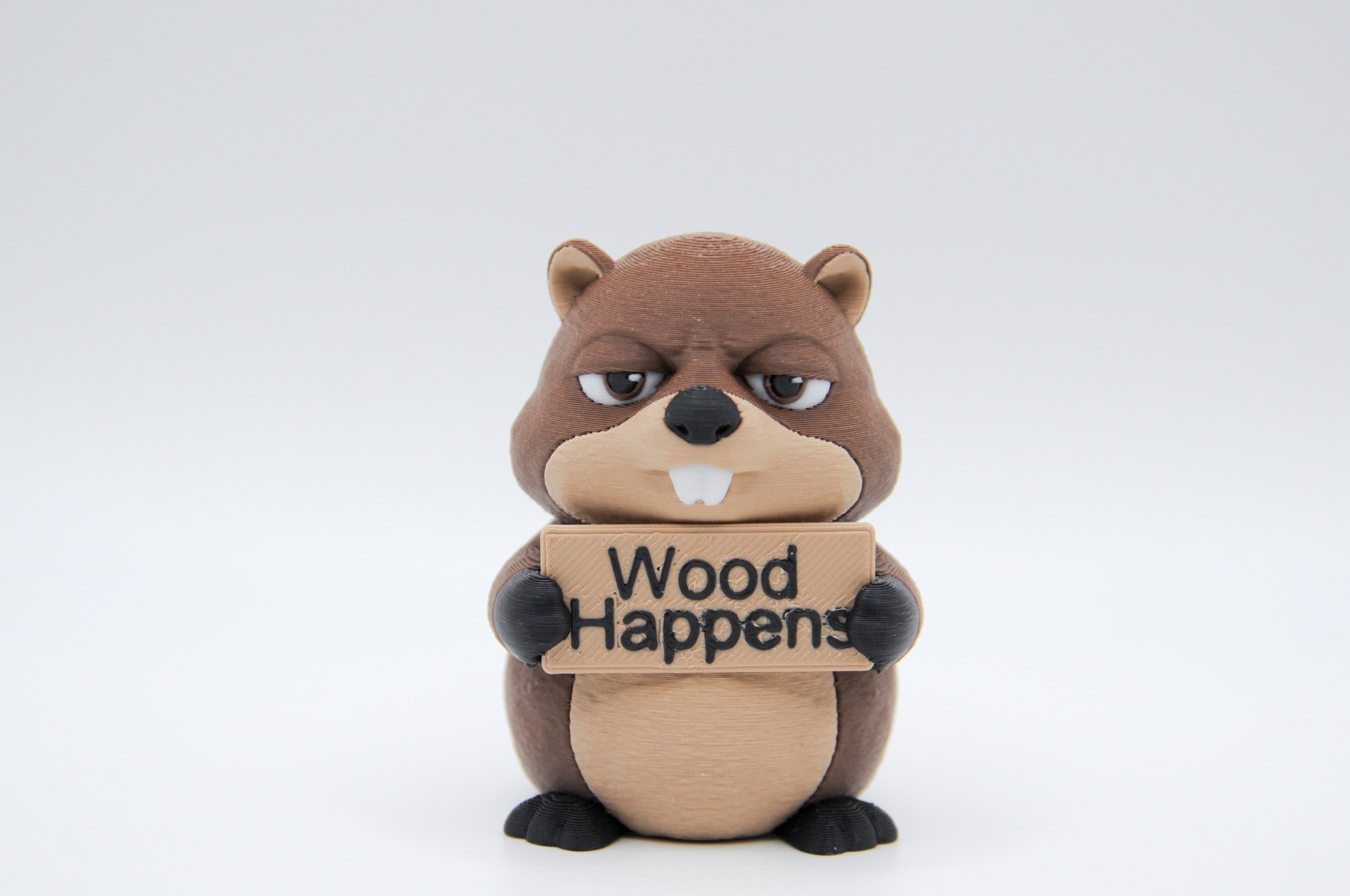 Beaver holding a Wood Happens sign