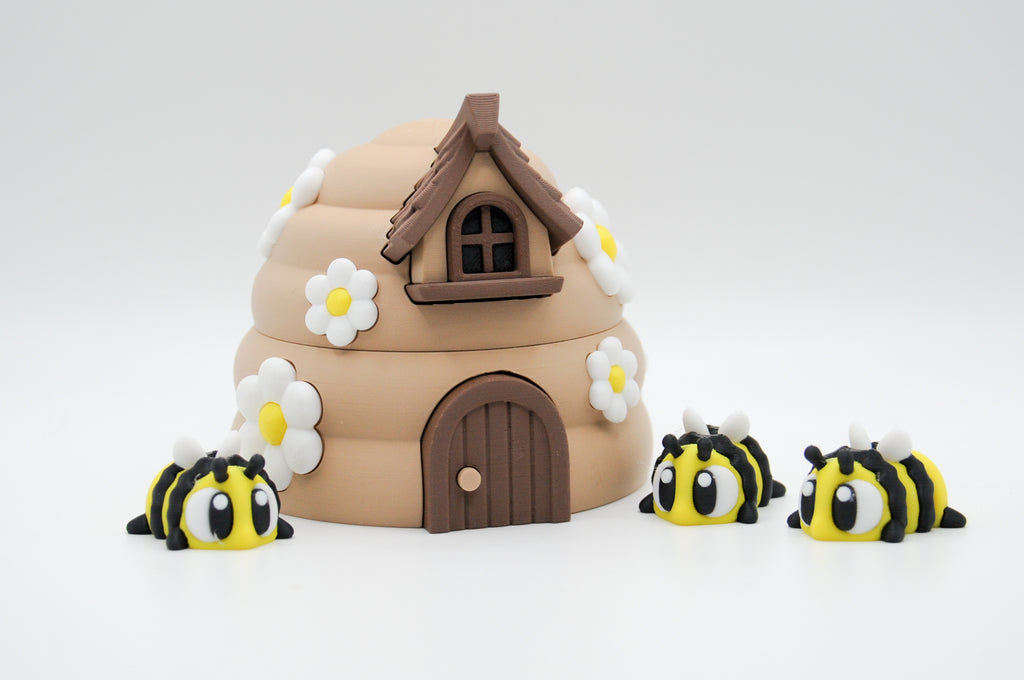 Alternate view of a flower-covered bee hive and striped bee figures