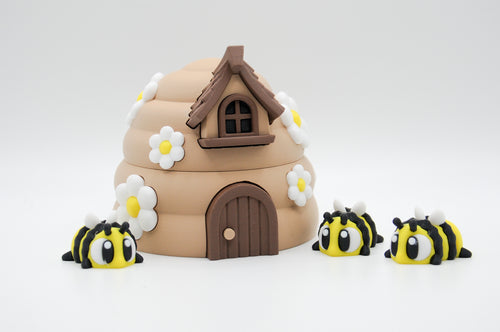 Alternate view of a flower-covered bee hive and striped bee figures