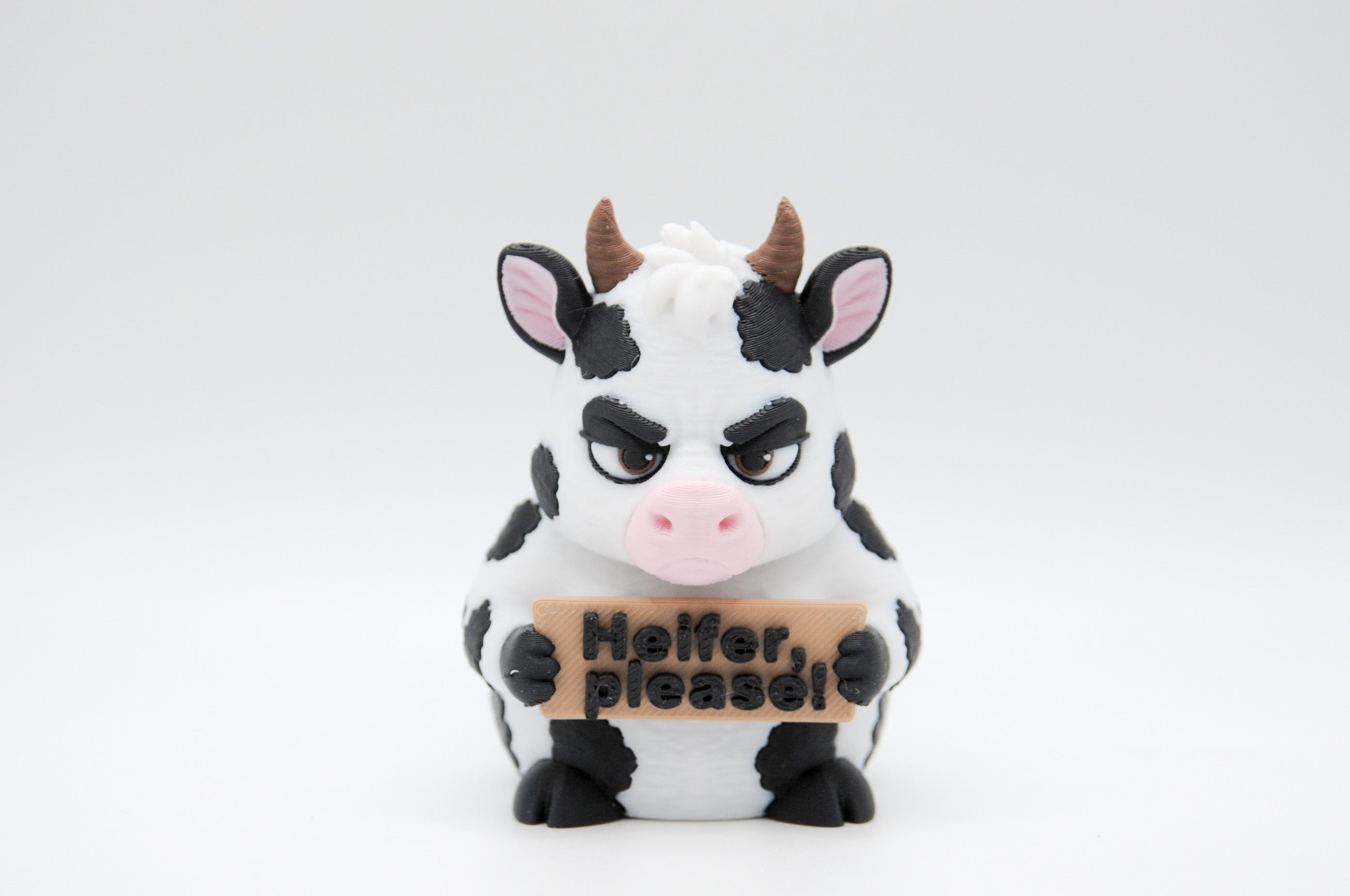 Cow holding a Heifer, Please sign