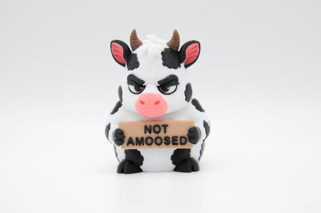 Cow holding a Not Amoosed sign