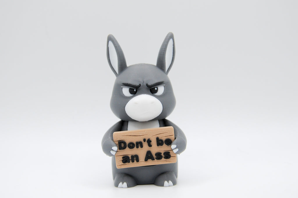 Donkey holding a Don't Be an Ass sign