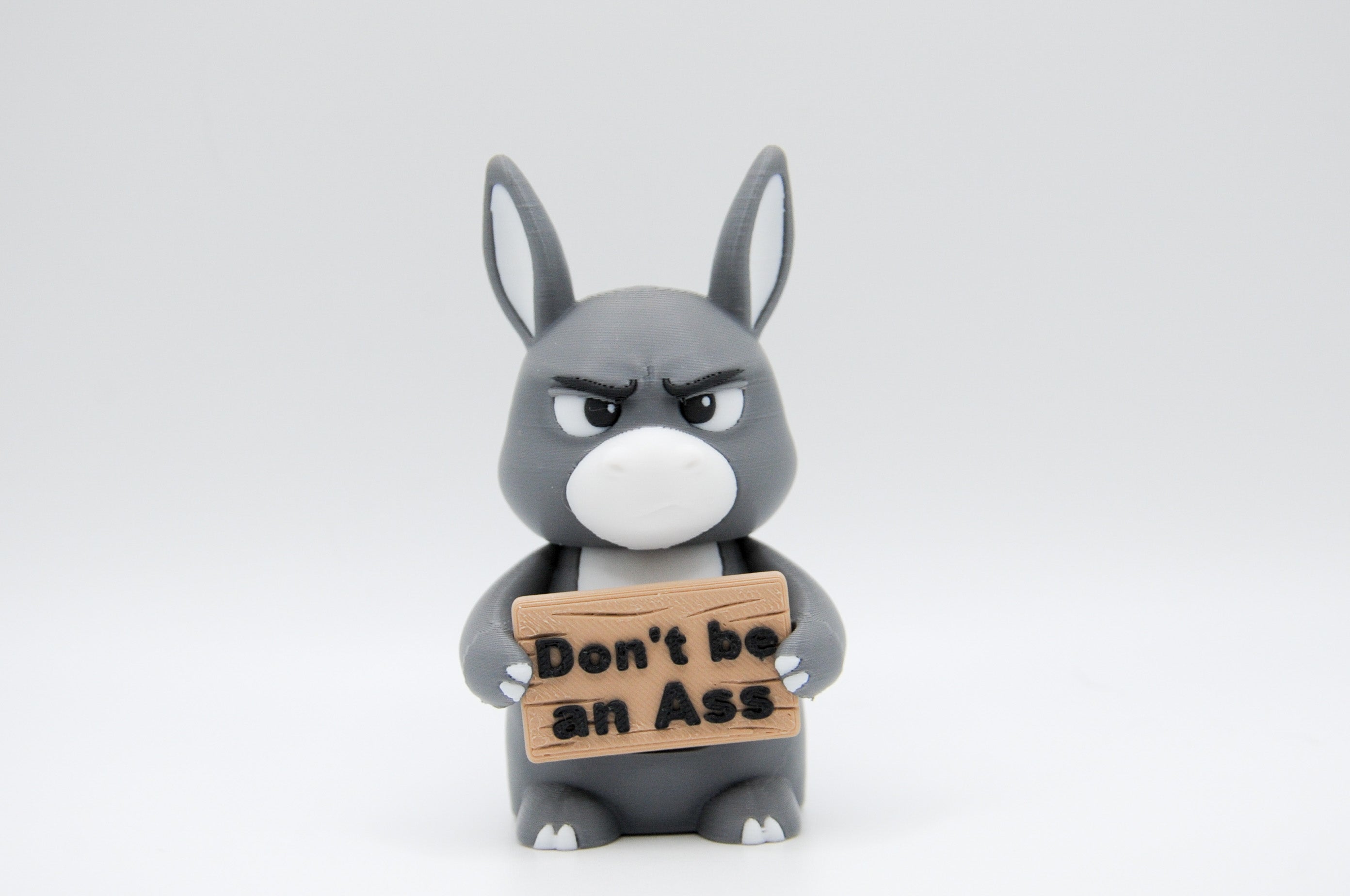 Donkey holding a Don't Be an Ass sign