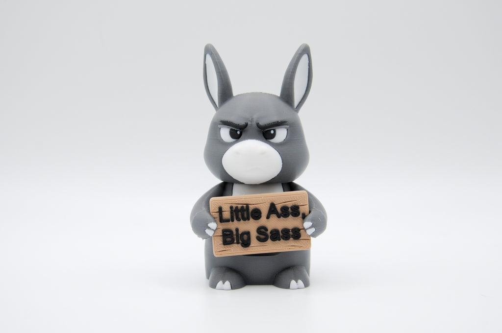Donkey holding a Little Ass, Big Sass sign