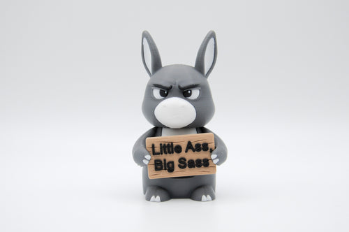 Donkey holding a Little Ass, Big Sass sign