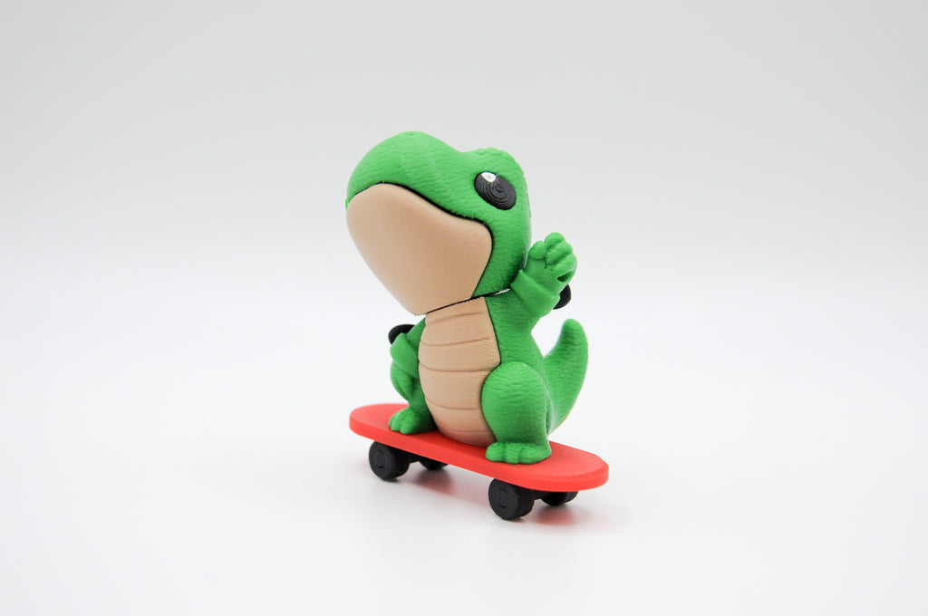 Green frog figure riding a red skateboard