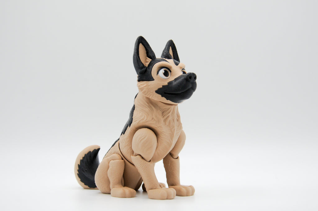 Tan and black German shepherd figure seated in profile
