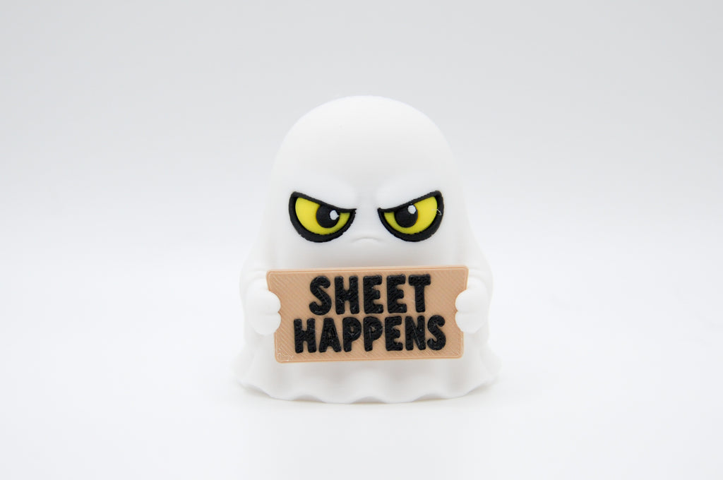 Ghost holding a Sheet Happens sign on a white background