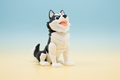 Black and white husky figure on a soft blue and cream background