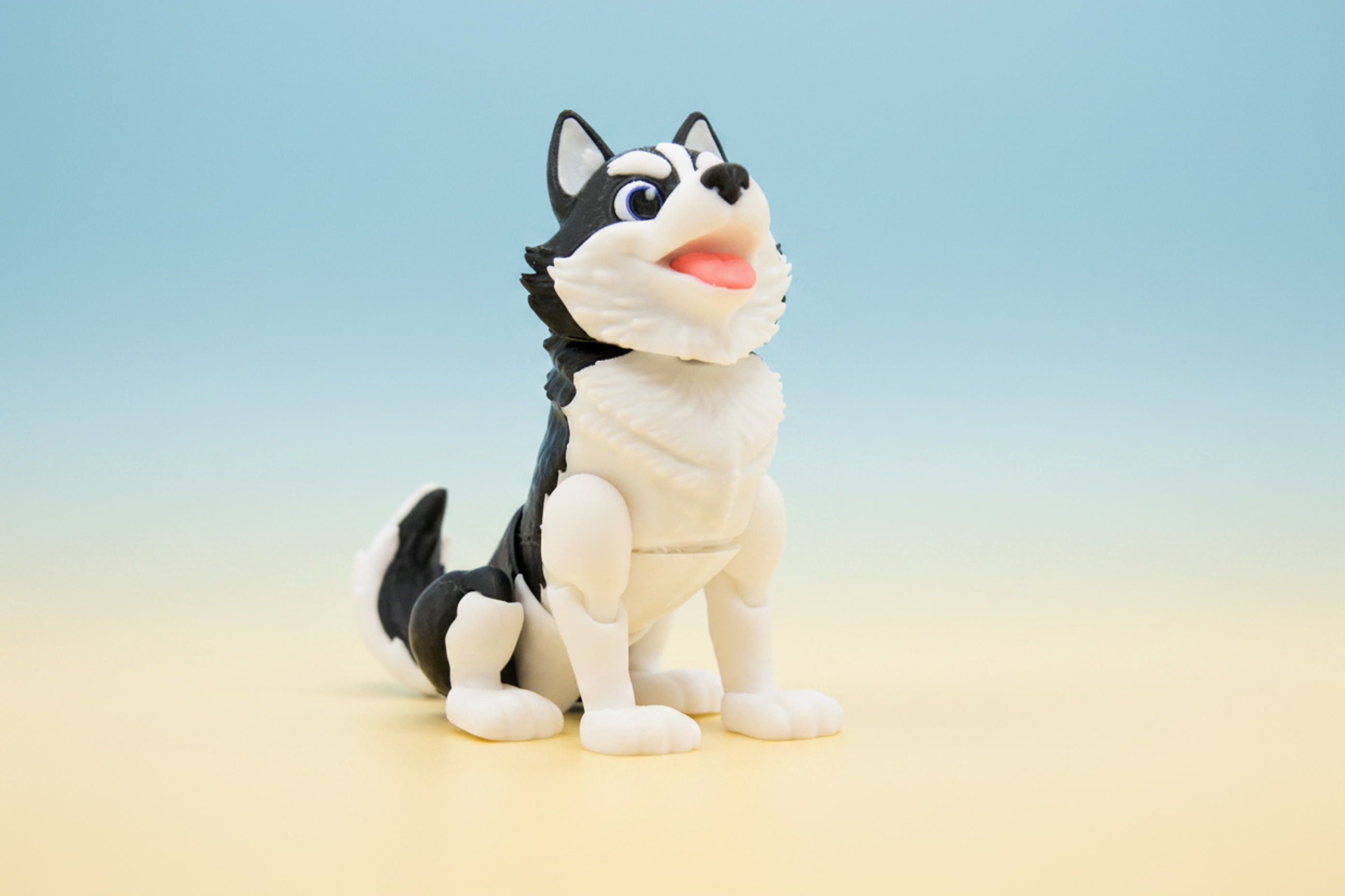 Black and white husky figure on a soft blue and cream background