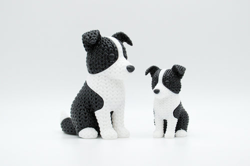 Black and white knitted-style border collie figures in large and small sizes
