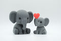 Gray knitted-style elephant figures in large and small sizes