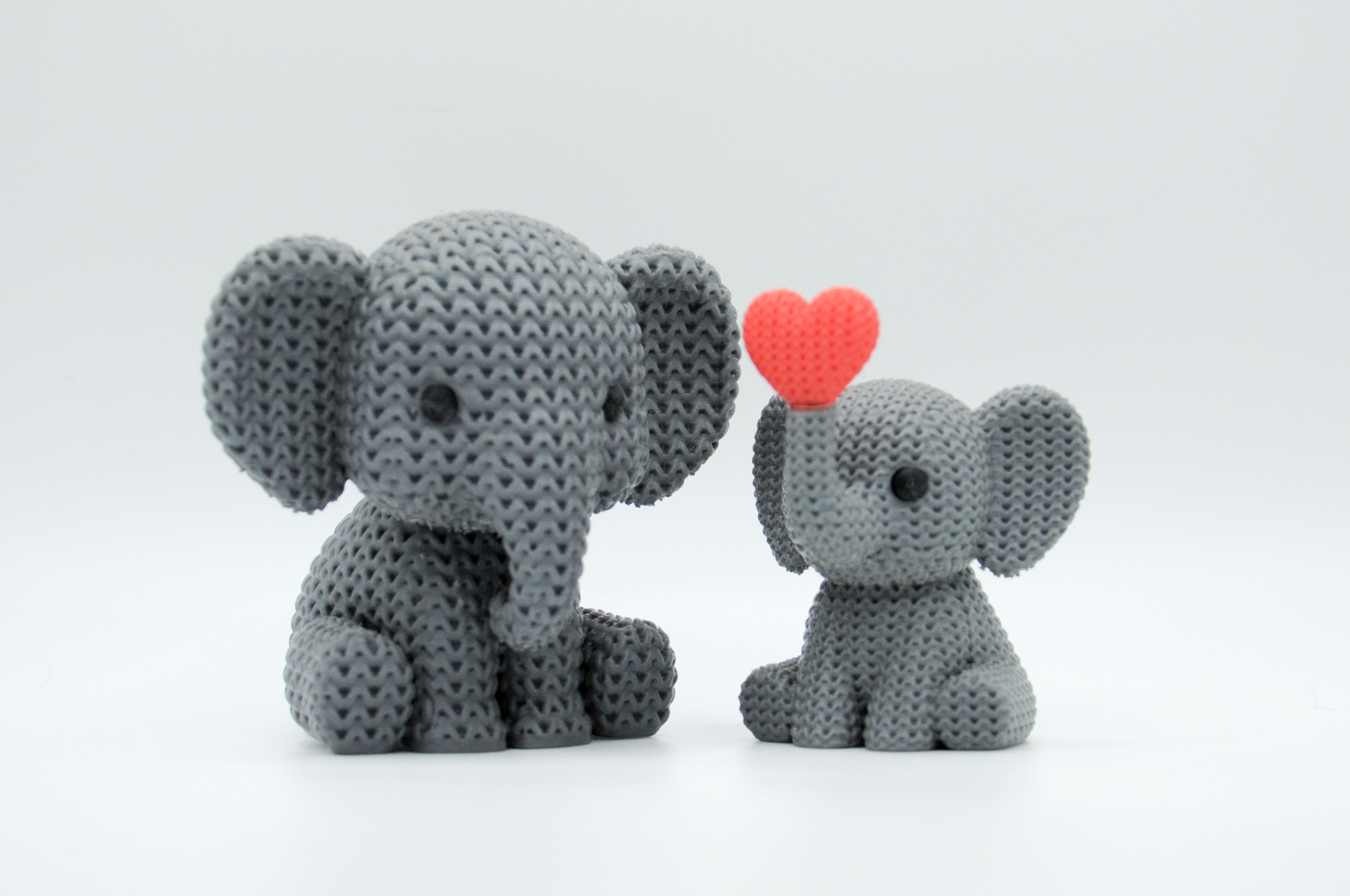 Gray knitted-style elephant figures in large and small sizes