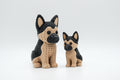 Tan and black knitted-style German shepherd figures in large and small sizes