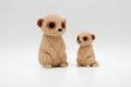 Tan knitted-style meerkat figures in large and small sizes