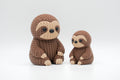 Brown knitted-style sloth figures in large and small sizes