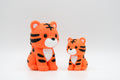 Orange and black knitted-style tiger figures in large and small sizes