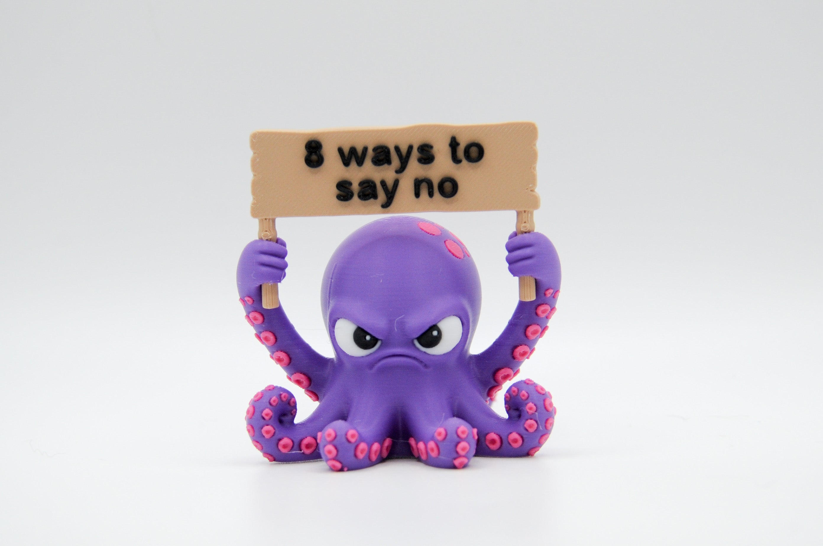 Purple octopus holding an 8 Ways to Say No sign