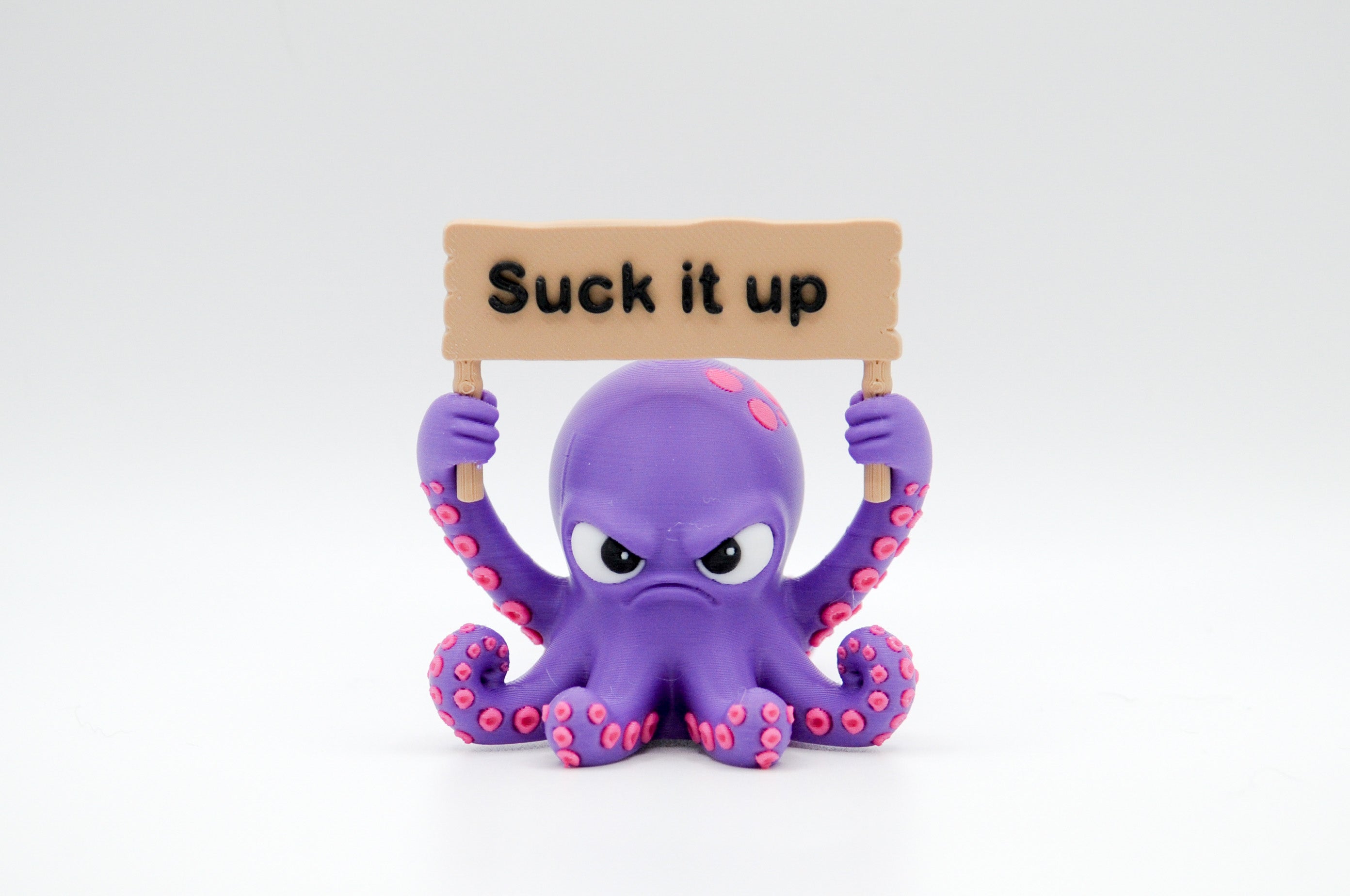 Purple octopus holding a Suck It Up sign