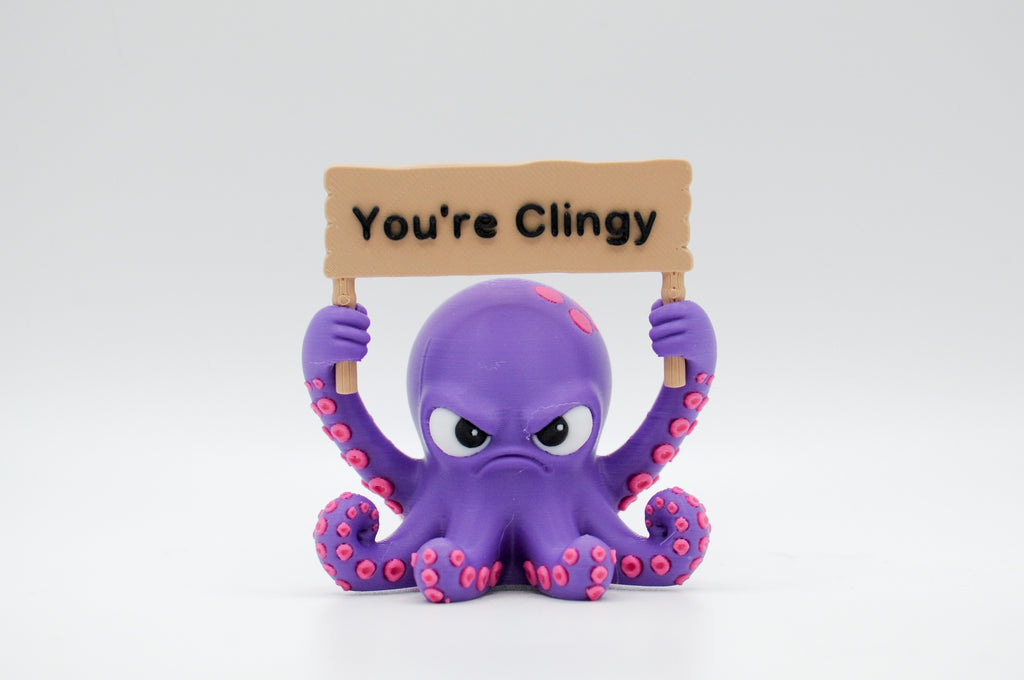 Purple octopus holding a You're Clingy sign
