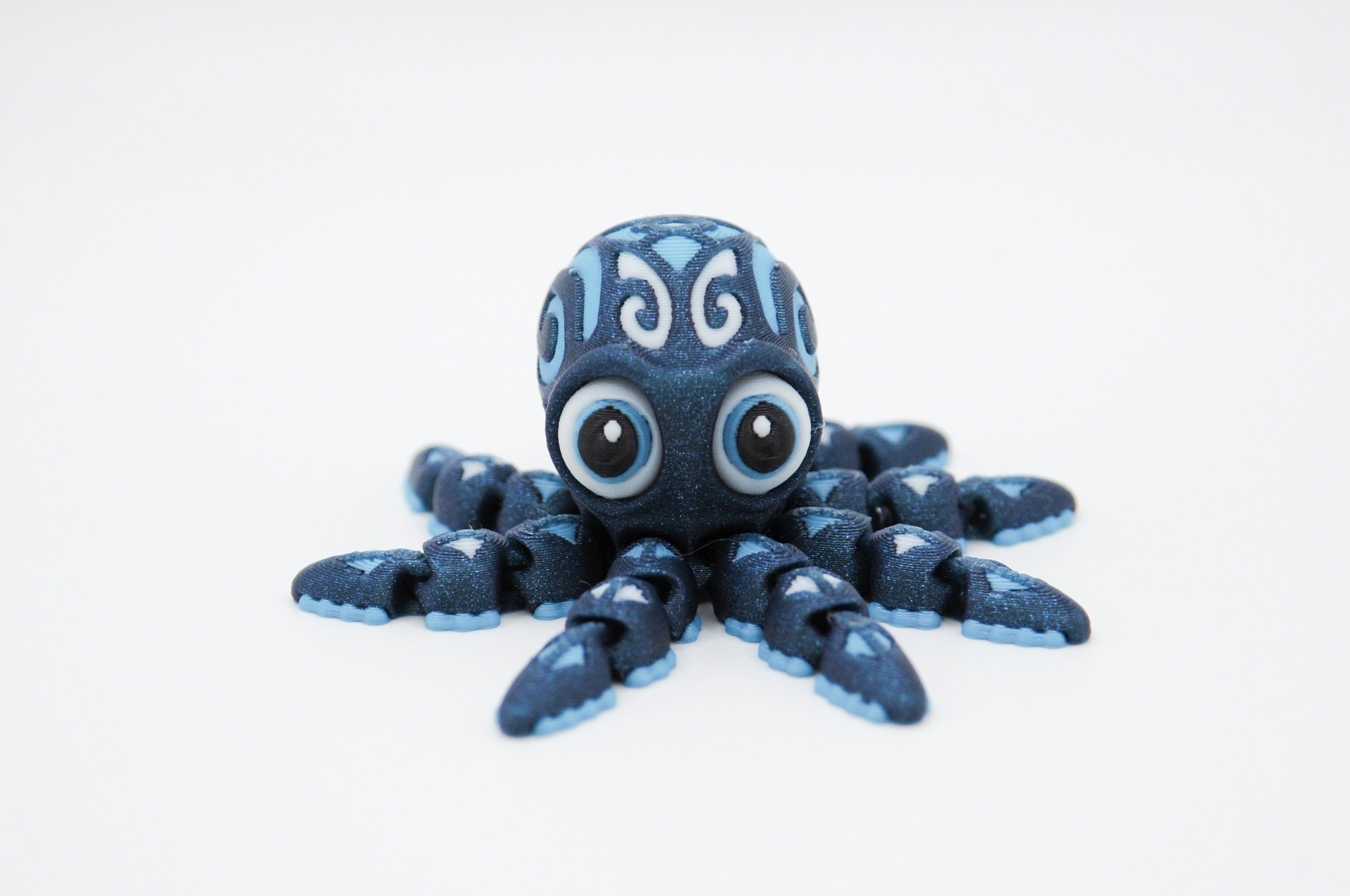 Dark blue octopus figure with pale blue decorative patterns