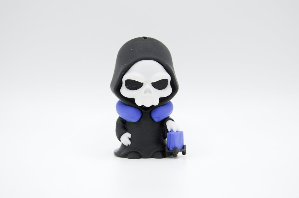 Hooded reaper figure with purple travel pillow and rolling luggage