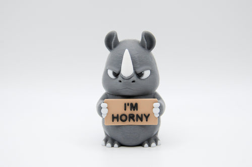 Rhinoceros holding an I'm Horny sign
