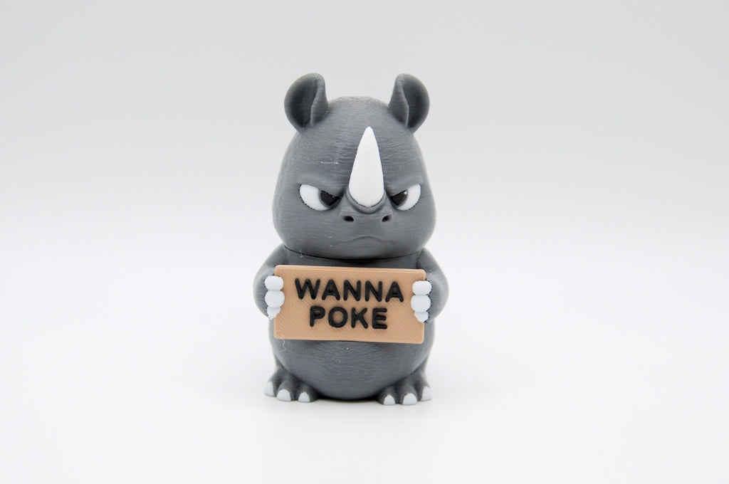 Rhinoceros holding a Wanna Poke sign