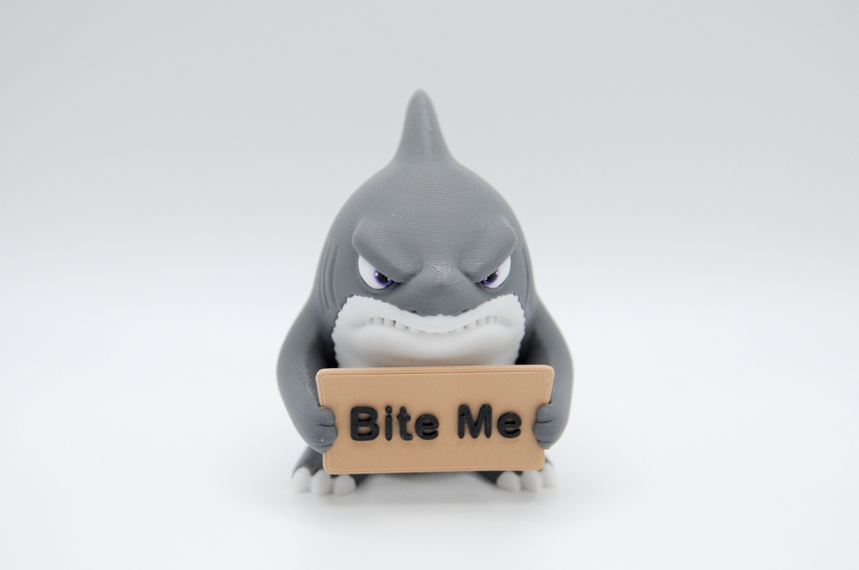 Shark holding a Bite Me sign