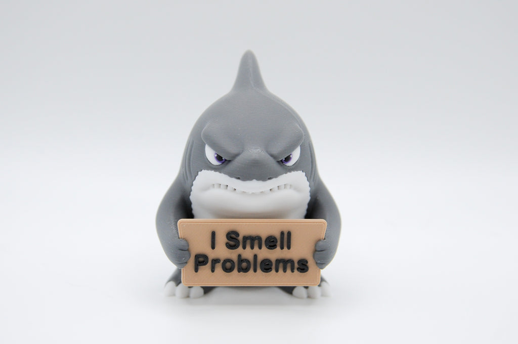 Shark holding an I Smell Problems sign