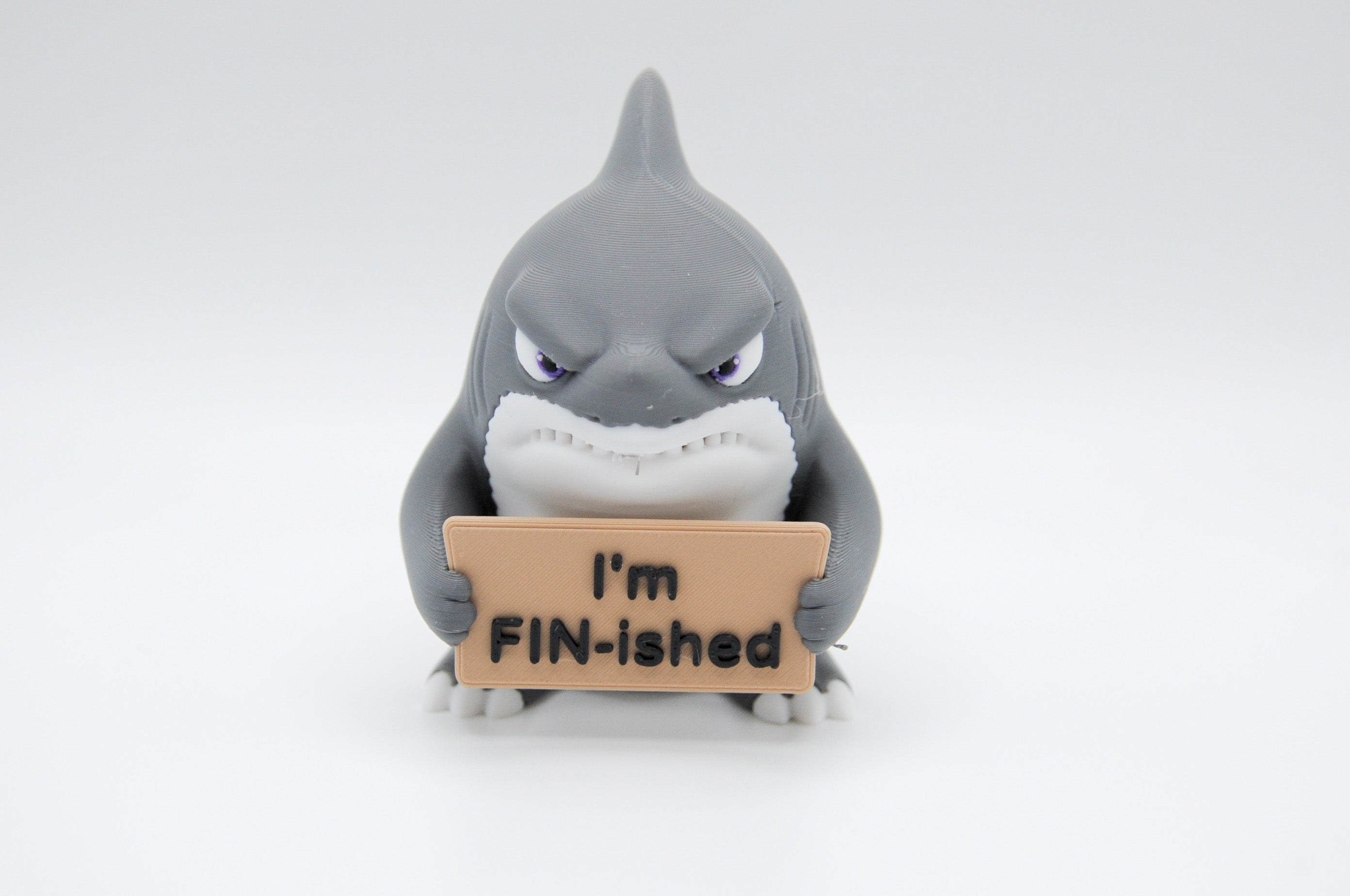 Shark holding an I'm FIN-ished sign